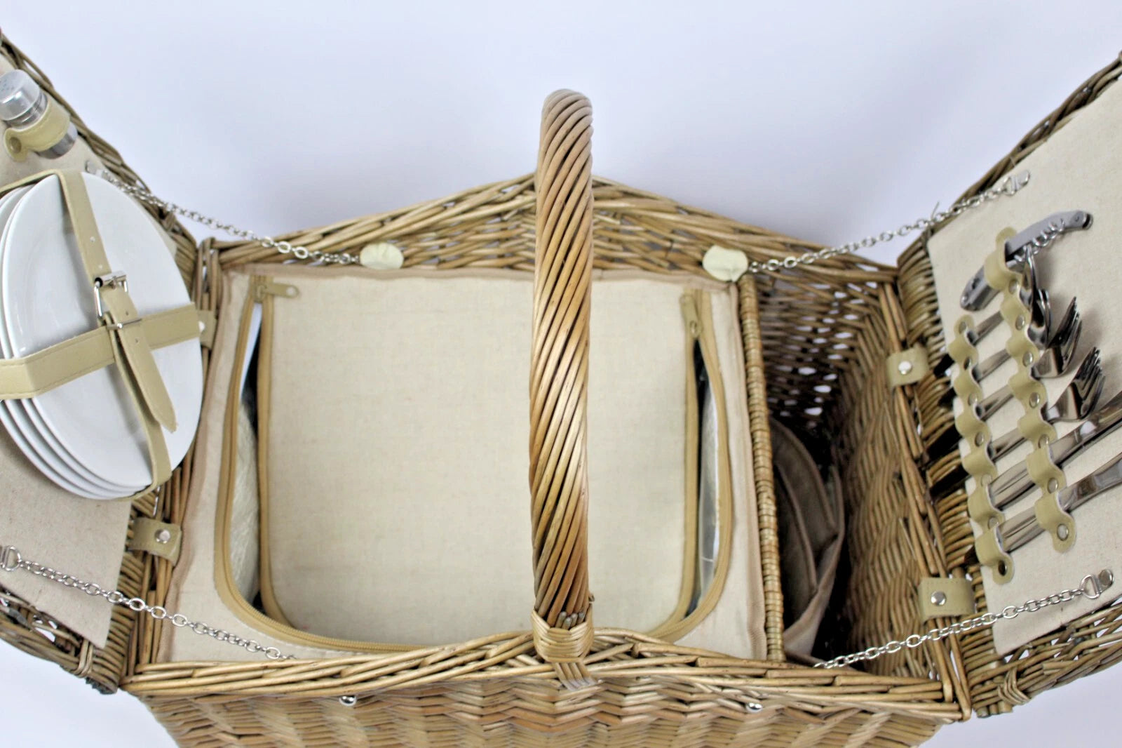 Picnic hamper Wicker summer treats for four people Plates knives forks etc.