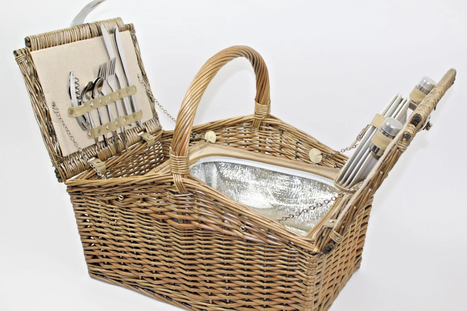 Picnic hamper Wicker summer treats for four people Plates knives forks etc.